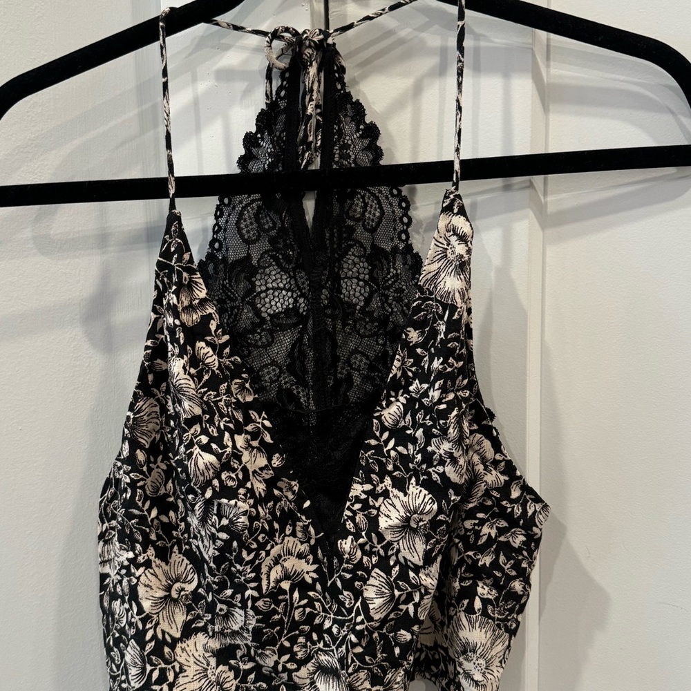 Free people, black/cream t-back cropped top, lace back, floral design. Size M